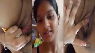 Naughty brunette teen fingering her tight pussy