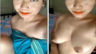 Exclusive video of a stunning girl getting naked and revealing her breasts and vagina