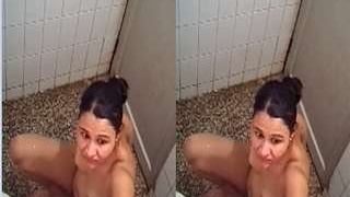 Watch a gorgeous Indian girl take a bath in this steamy video