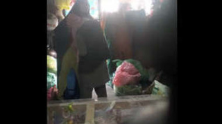 Mature couple enjoys romance in Pakistani shop