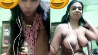 Busty Indian babe flaunts her curves in a solo show