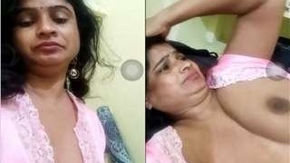 Telugu bhabhi flaunts her breasts in a steamy video