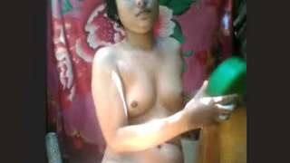 Desi girl's solo bathroom nudity captured on camera