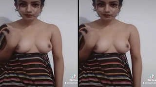 Adorable Indian woman flaunts her breasts