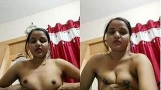 Busty Indian babe teases the camera with her big tits