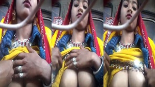 A girl with large breasts displays them on camera