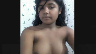 Cute Indian girl wearing cloths after bathing