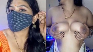 Arousing Indian woman with large breasts performs sexual show