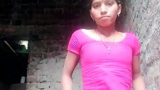 Indian girl in village performs solo striptease on camera