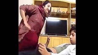 Indian aunty gets naughty on camera
