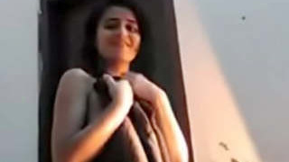 Naughty babe gets naked and shows off her body in a steamy video