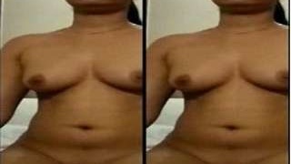 Indian babe strips and masturbates in front of the camera