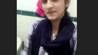 Beautiful girlfriend shows boyfriend how to use toilet