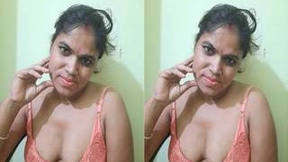 Horny babe shows off her big tits and masturbates in part 2