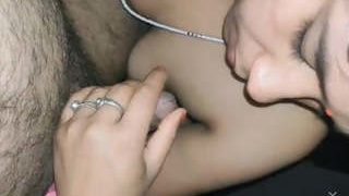 Adorable wife gives a blowjob to her husband