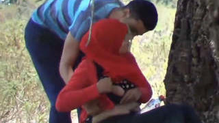 Arab couple enjoys outdoor smooching and boob play