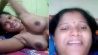 Exclusive video of a sultry Indian bhabhi flaunting her huge breasts