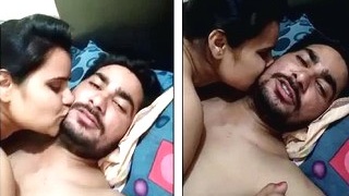 Passionate newlyweds share a steamy kiss in bed