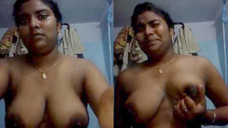 Tamil teen shows off her big boobs and squeezes them with a seductive smile