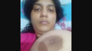 A stunning Desi woman flaunts her large breasts