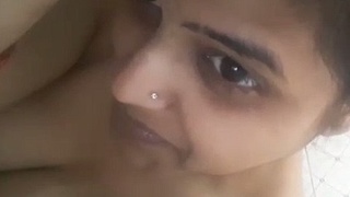 Watch a hot Indian bhabhi strip and show off her body in a solo video