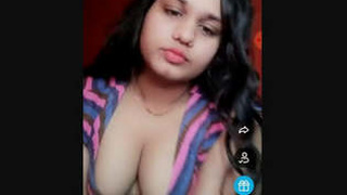 Ruthvika Sharma, an Indian girl, enjoys playing with her breasts on camera