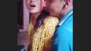A young couple gets frisky in a crowded Nepali restaurant