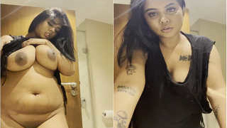 Indian amateur Oasi DAS reveals her large breasts and masturbates with her hands