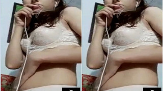 Cute Indian girl masturbates with her boobs on camera