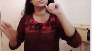Desi bhabhi with long hair strips naked for a bathroom selfie