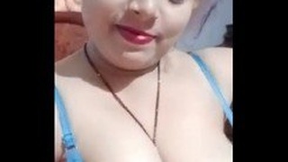 Watch a stunning desi bhabhi show off her big boobs in this video