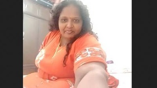 Fatty aunty flaunts her big boobs and pussy