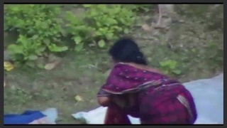 Indian wife's large breasts sway in a village-themed porn video